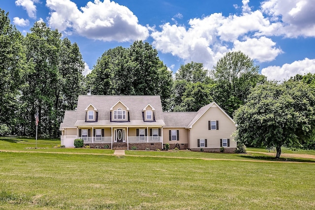 cape cod house with crawl space, covered porch, and a front yard