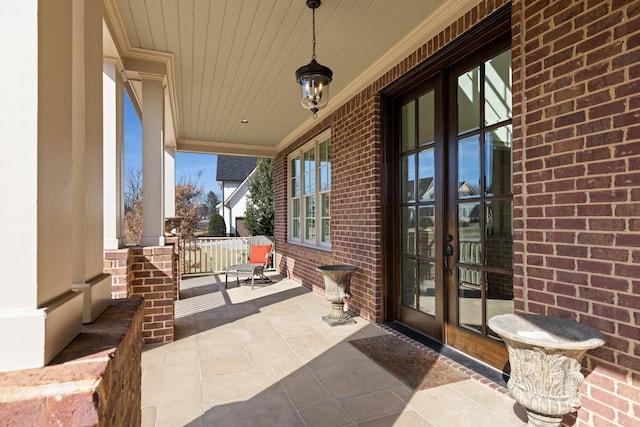 view of patio with a porch and french doors