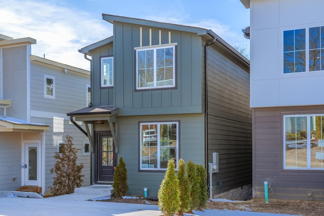 contemporary house featuring board and batten siding