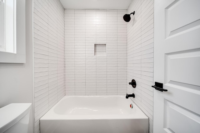bathroom with shower / washtub combination and toilet