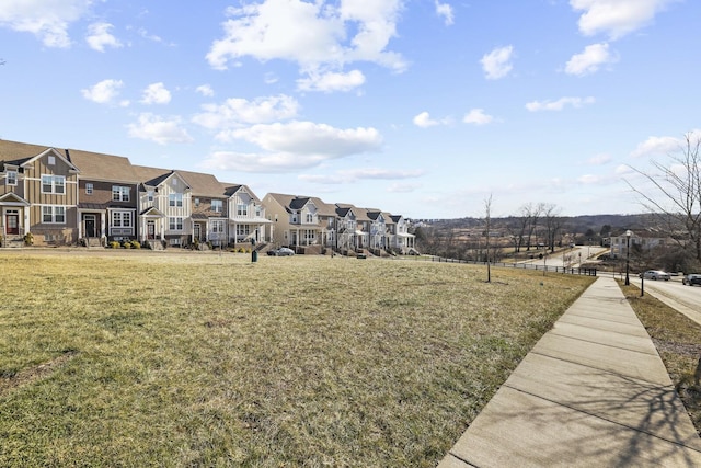 view of yard featuring a residential view