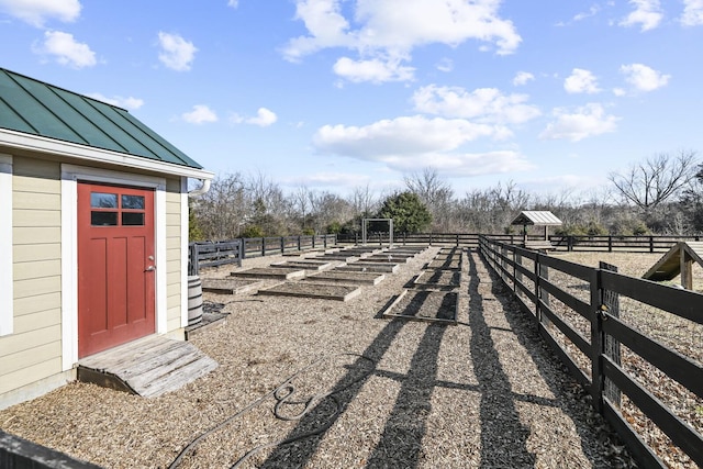 view of yard featuring a rural view and fence