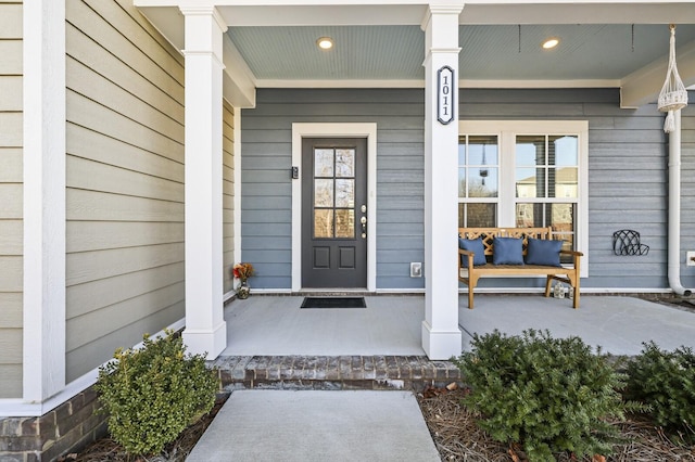 doorway to property featuring covered porch