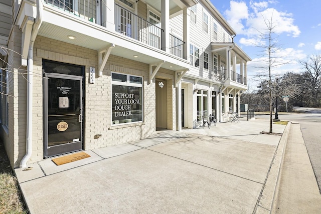 entrance to property with brick siding