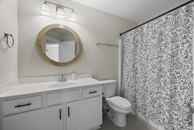 bathroom featuring toilet, vanity, and tile patterned floors