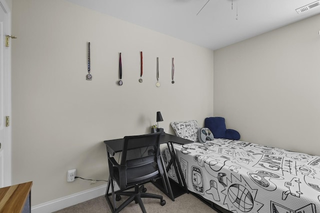 carpeted bedroom featuring visible vents and baseboards