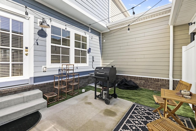 view of patio featuring a grill