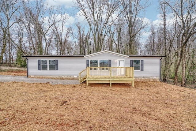 view of front of home featuring a wooden deck