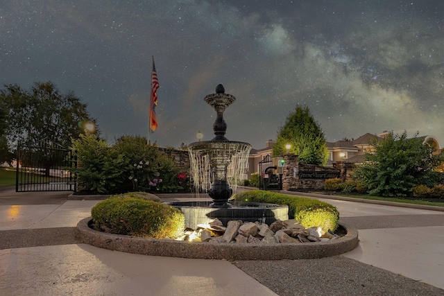 view of home's community featuring a gate