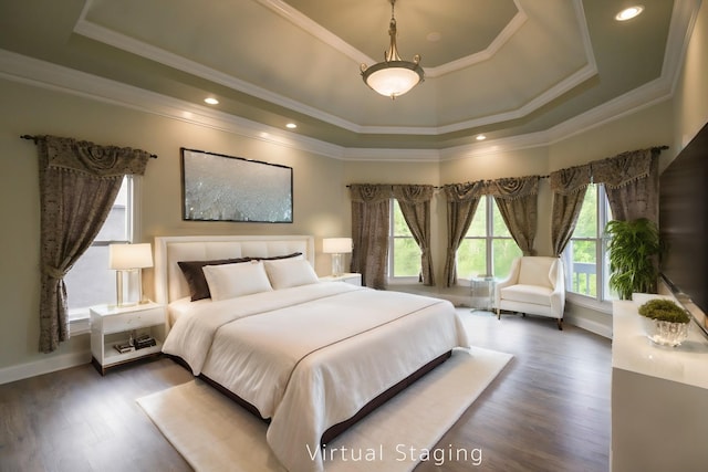 bedroom featuring crown molding, a tray ceiling, dark wood finished floors, and baseboards