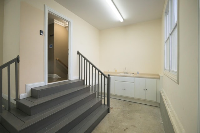 stairway with concrete floors