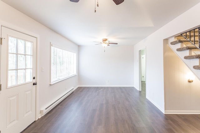 unfurnished room featuring a baseboard radiator, stairway, ceiling fan, and dark wood-style flooring