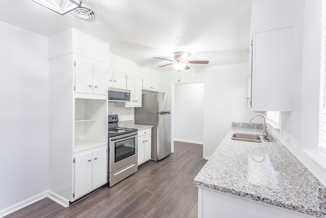 kitchen featuring a sink, white cabinets, appliances with stainless steel finishes, dark wood-style floors, and open shelves