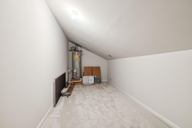 interior space with gas water heater and visible vents