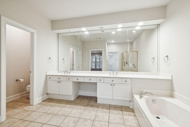 bathroom with a garden tub, a sink, a shower stall, and tile patterned floors