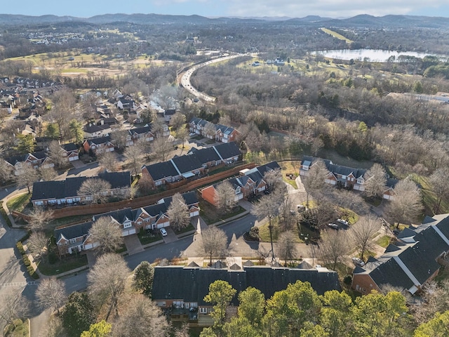 aerial view featuring a water and mountain view and a residential view