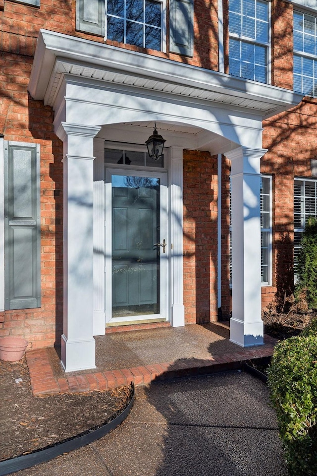 entrance to property with brick siding