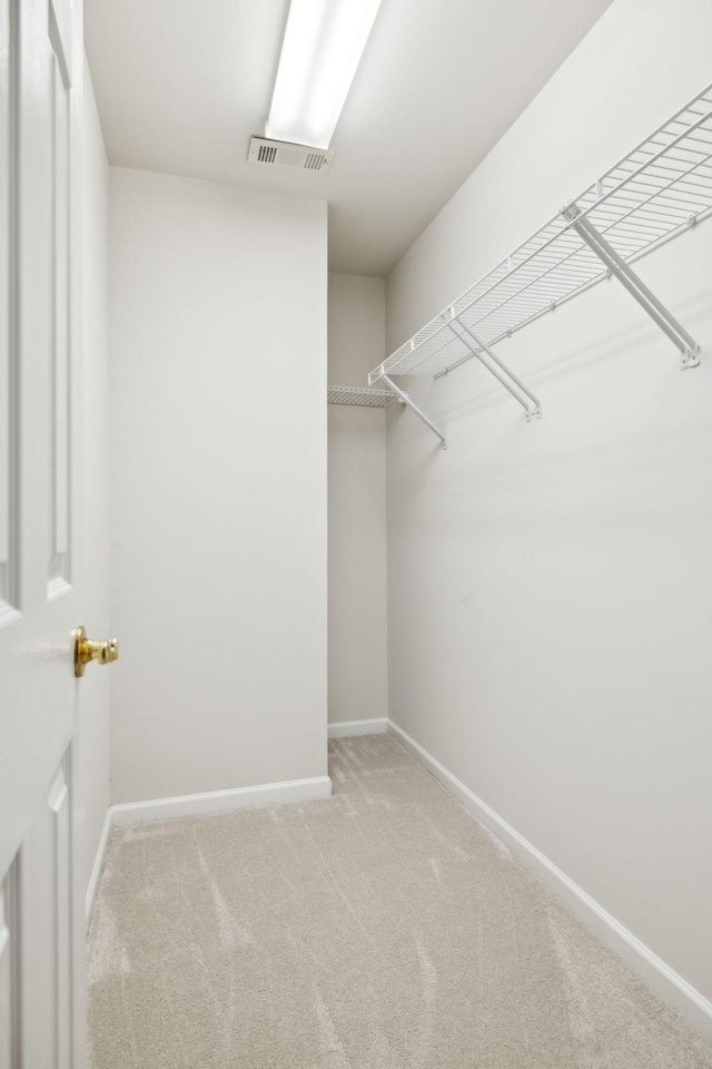 walk in closet with carpet and visible vents