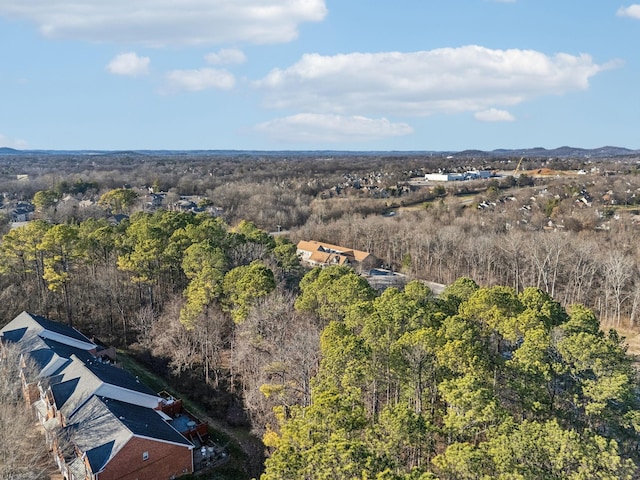 birds eye view of property featuring a wooded view