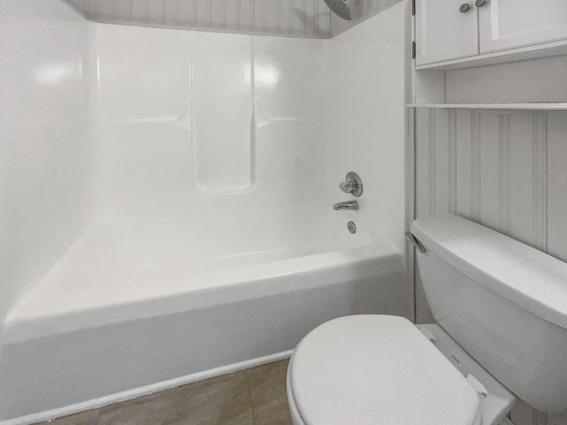 bathroom featuring bathtub / shower combination and toilet