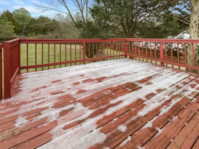 wooden terrace featuring a lawn