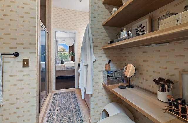 interior space featuring wallpapered walls and tile patterned floors