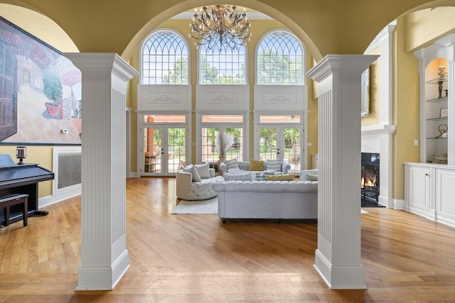 1465 New Columbia Hwy, Lewisburg, TN 37091 - living room featuring a wealth of natural light, ornate columns, and wood finished floors
