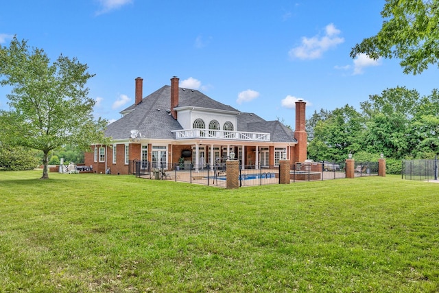 1465 New Columbia Hwy, Lewisburg, TN 37091 - rear view of house with a patio, a balcony, fence, an outdoor pool, and a lawn
