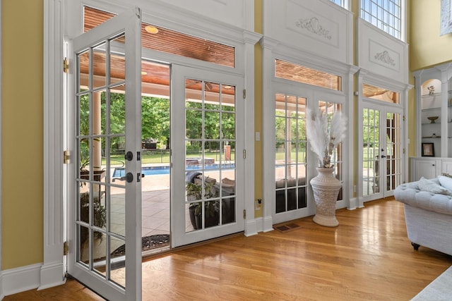 1465 New Columbia Hwy, Lewisburg, TN 37091 - doorway to outside with wood finished floors, visible vents, baseboards, french doors, and a towering ceiling
