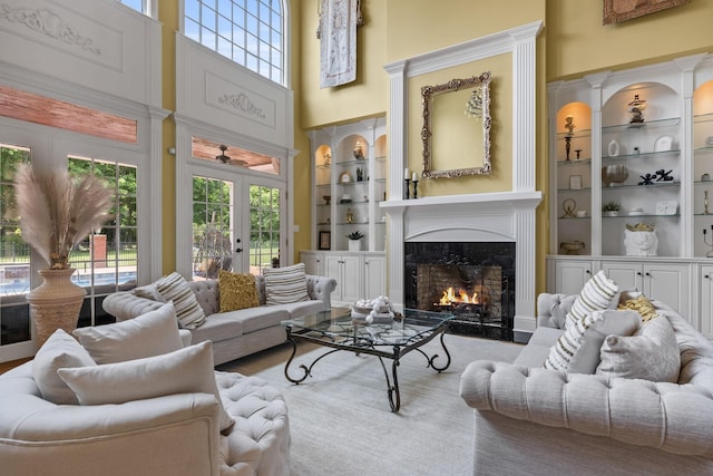 1465 New Columbia Hwy, Lewisburg, TN 37091 - living room featuring a wealth of natural light, french doors, built in shelves, and a fireplace
