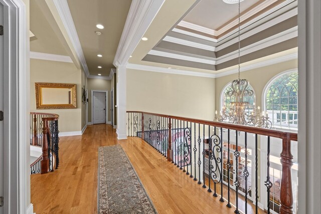 1465 New Columbia Hwy, Lewisburg, TN 37091 - corridor with a tray ceiling, a notable chandelier, wood finished floors, and ornamental molding