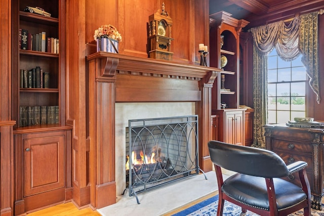 1465 New Columbia Hwy, Lewisburg, TN 37091 - living area with built in shelves, a lit fireplace, and beam ceiling