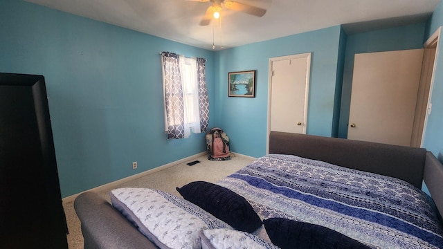 bedroom featuring carpet floors, visible vents, baseboards, and a ceiling fan