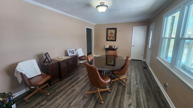 dining room featuring dark wood-type flooring, a wealth of natural light, and baseboards