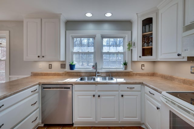 kitchen featuring white appliances, glass insert cabinets, white cabinets, and a sink