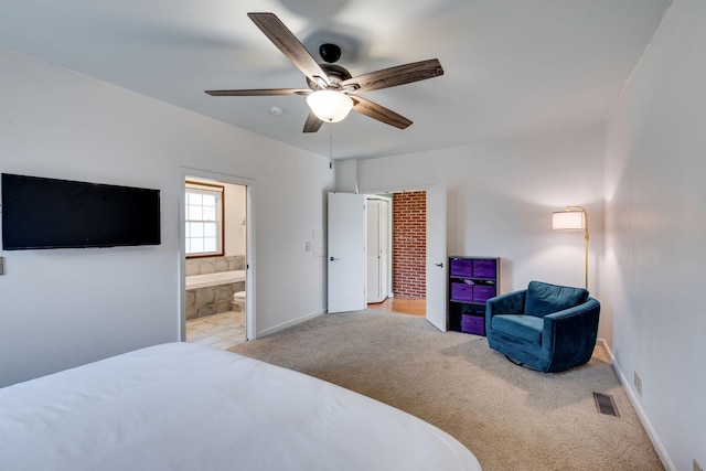 bedroom with carpet, visible vents, connected bathroom, and baseboards