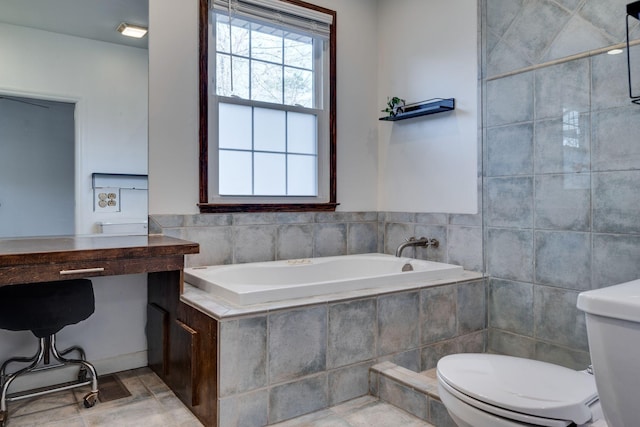 bathroom featuring toilet and a bath