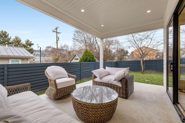 view of patio / terrace featuring a fenced backyard and an outdoor living space