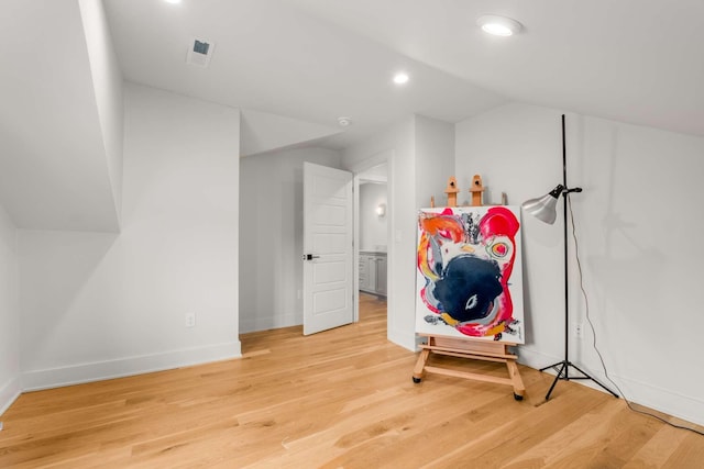 bonus room featuring baseboards, vaulted ceiling, wood finished floors, and recessed lighting