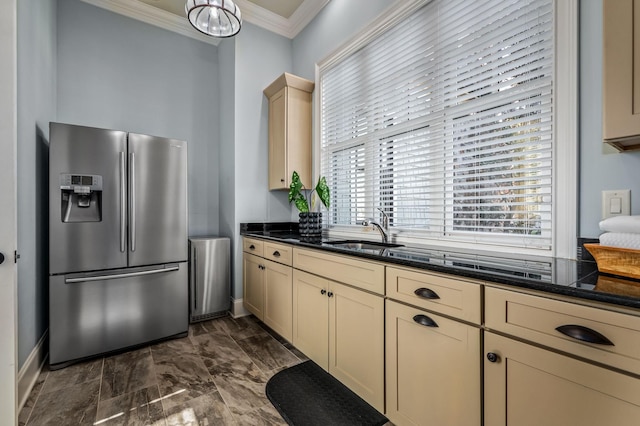 6054 Pelican Way, College Grove, TN 37046 - kitchen with stainless steel fridge with ice dispenser, ornamental molding, cream cabinets, dark marble finish flooring, and dark stone countertops