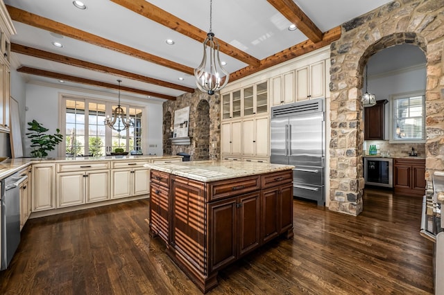 6054 Pelican Way, College Grove, TN 37046 - kitchen with appliances with stainless steel finishes, beverage cooler, a chandelier, cream cabinetry, and beamed ceiling