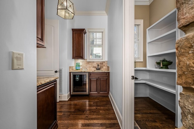6054 Pelican Way, College Grove, TN 37046 - indoor dry bar with beverage cooler, crown molding, dark wood finished floors, and decorative backsplash