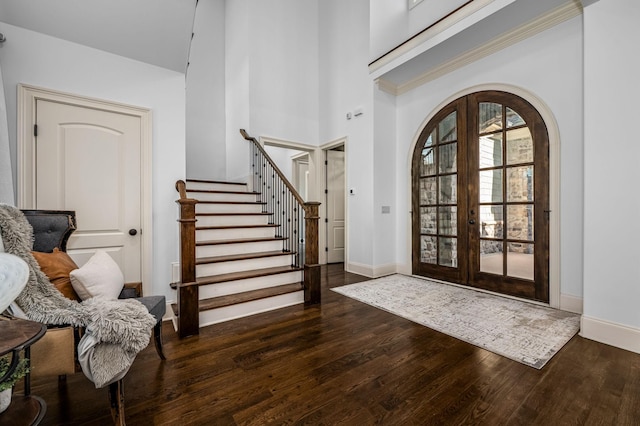 6054 Pelican Way, College Grove, TN 37046 - entryway with wood finished floors, arched walkways, french doors, stairs, and a high ceiling