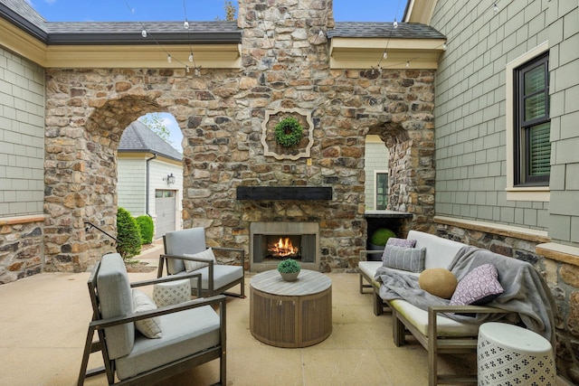 6054 Pelican Way, College Grove, TN 37046 - view of patio / terrace with an outdoor living space with a fireplace