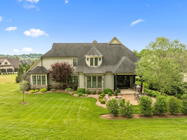 6054 Pelican Way, College Grove, TN 37046 - back of property featuring a patio, a lawn, and a chimney