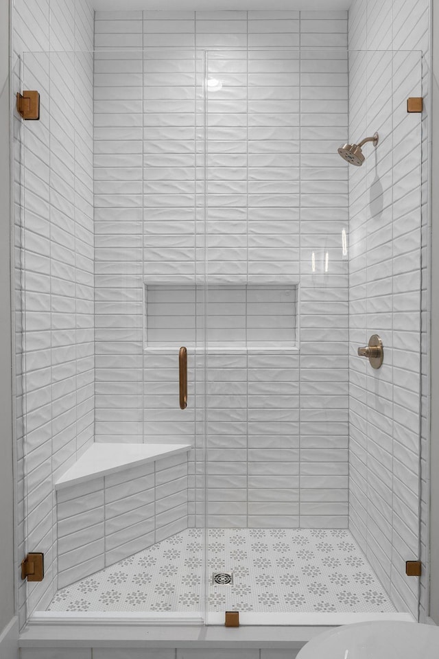 full bathroom featuring a shower stall