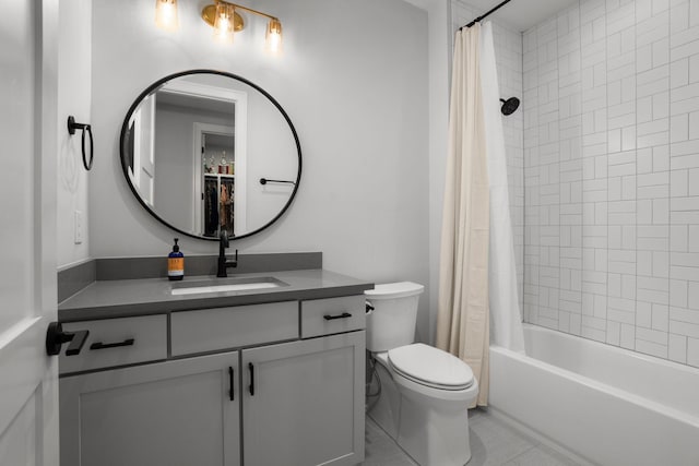 bathroom with shower / bath combination with curtain, vanity, and toilet