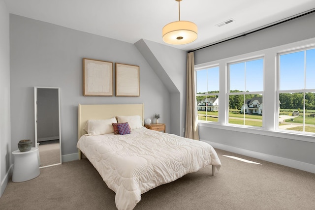 bedroom featuring carpet floors, baseboards, and visible vents