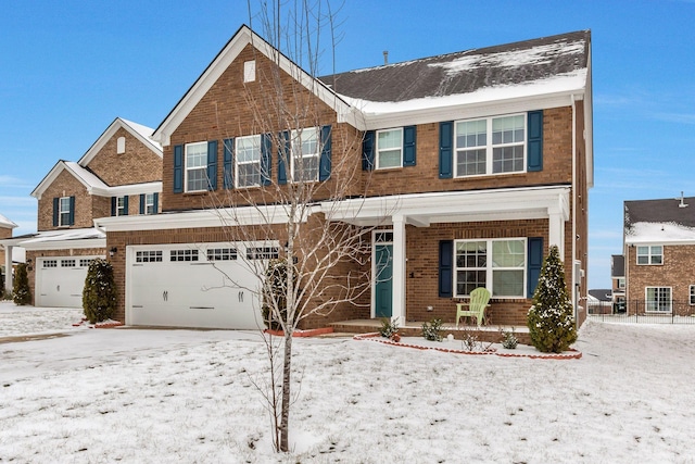 view of front of home featuring a garage and brick siding