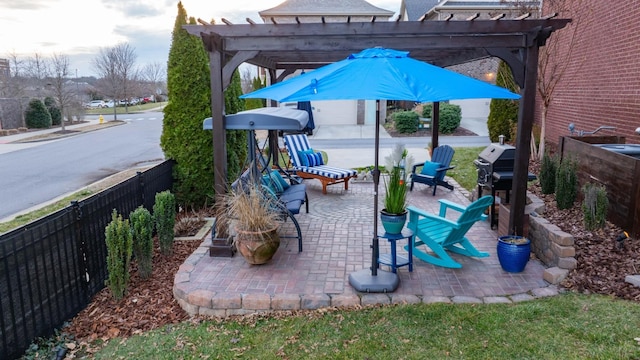 view of patio / terrace with fence, grilling area, and a pergola